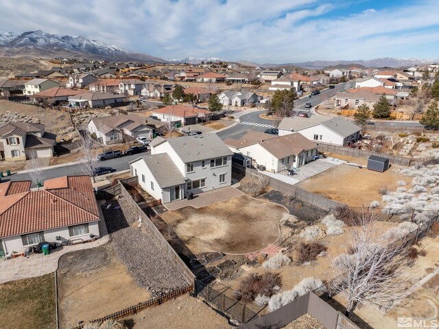 birds eye view of property with a mountain view