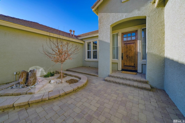 doorway to property with a patio area