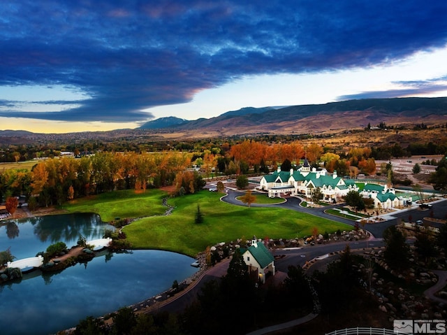 aerial view at dusk with a water and mountain view