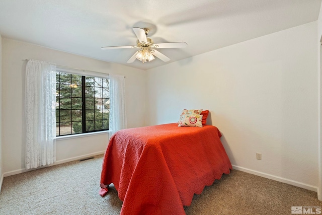 carpeted bedroom featuring ceiling fan