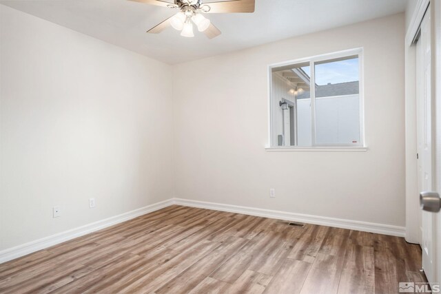 spare room with ceiling fan and light hardwood / wood-style flooring