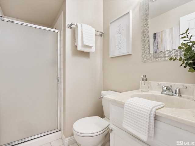 bathroom featuring vanity, toilet, and an enclosed shower