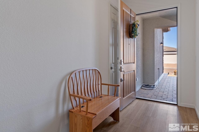 hallway featuring light wood-type flooring