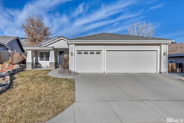 ranch-style house with a garage and a front yard