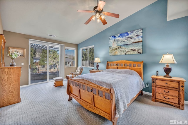 carpeted bedroom with vaulted ceiling, access to outside, and ceiling fan