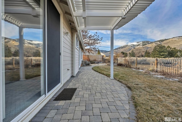 view of patio featuring a mountain view and a pergola