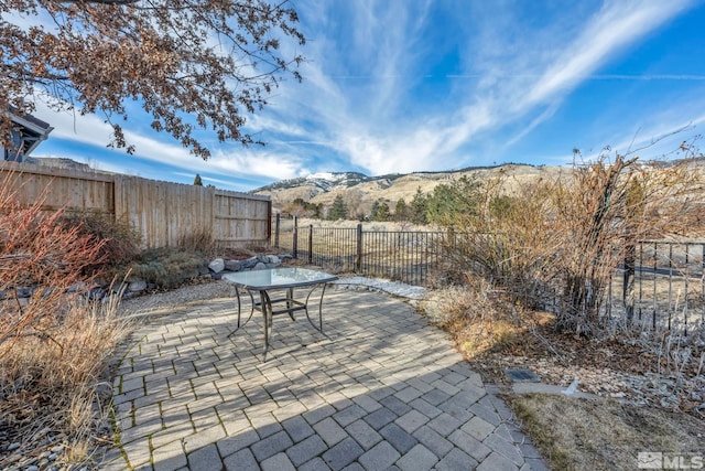 view of patio / terrace featuring a mountain view