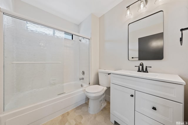 full bathroom with enclosed tub / shower combo, vanity, and toilet