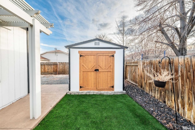 view of outdoor structure with a lawn