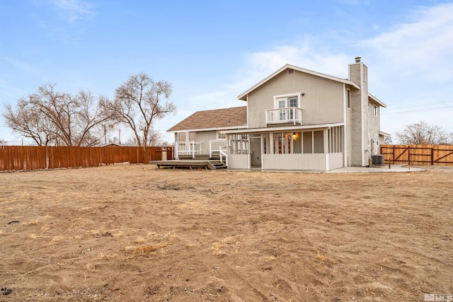 rear view of property featuring central AC, a balcony, a deck, and a patio