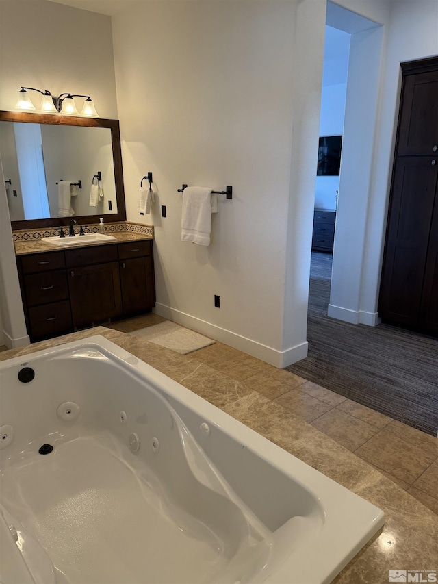 bathroom featuring vanity and a tub