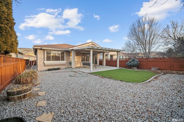 rear view of house with a patio