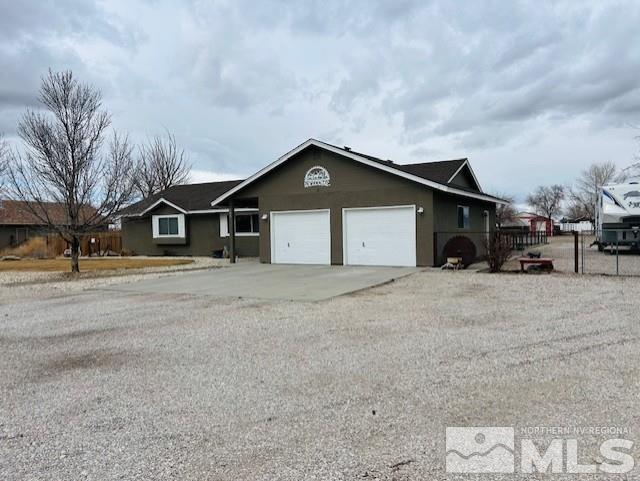 ranch-style house featuring a garage