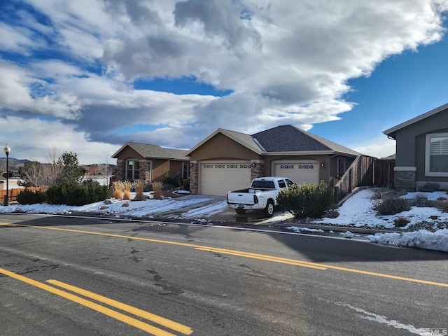 ranch-style home featuring a garage