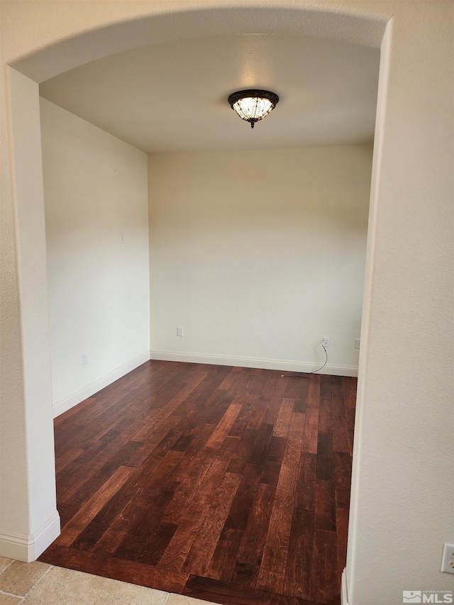 unfurnished room with hardwood / wood-style floors