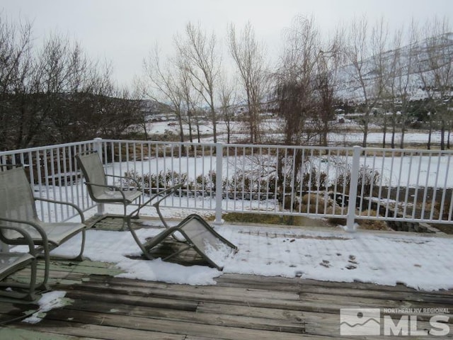 view of snow covered deck