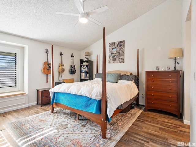 bedroom featuring hardwood / wood-style floors, vaulted ceiling, a textured ceiling, and ceiling fan