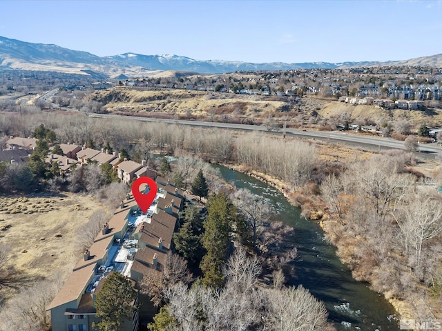 birds eye view of property featuring a mountain view