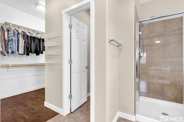 bathroom featuring an enclosed shower