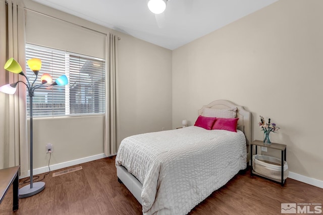 bedroom featuring dark wood-type flooring