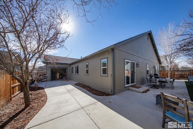 view of side of home with a patio