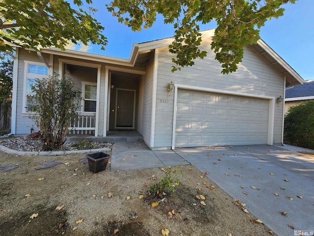 view of front of property with a garage and covered porch