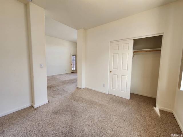 unfurnished bedroom featuring a closet and carpet flooring