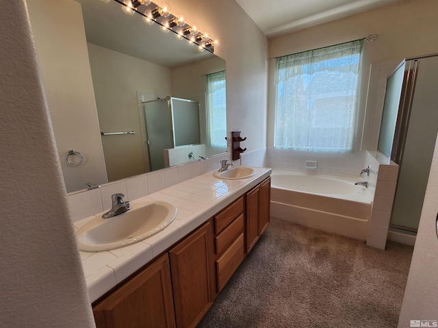 bathroom featuring independent shower and bath and vanity