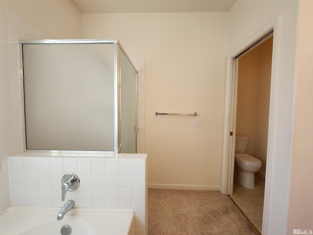 bathroom featuring separate shower and tub and toilet