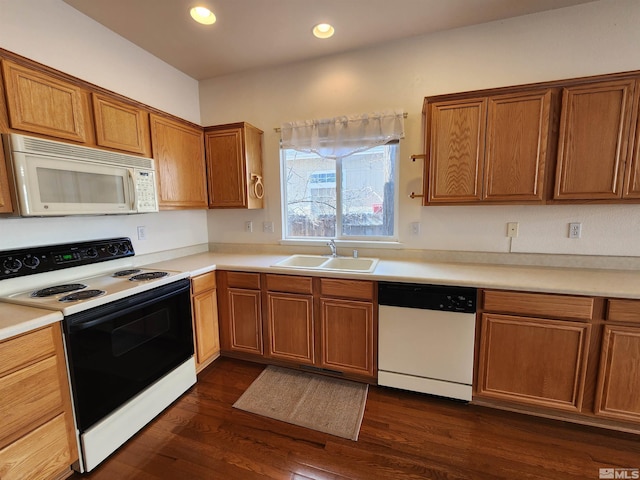 kitchen featuring sink, white appliances, and dark wood-type flooring