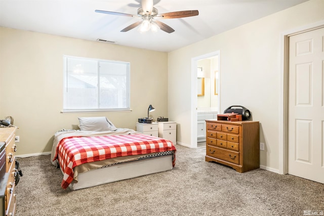 bedroom featuring ceiling fan, carpet, and ensuite bath