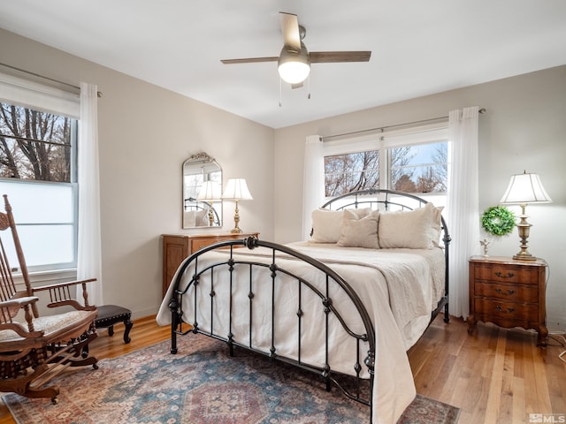 bedroom featuring ceiling fan and light hardwood / wood-style flooring