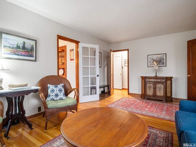 sitting room with light hardwood / wood-style floors