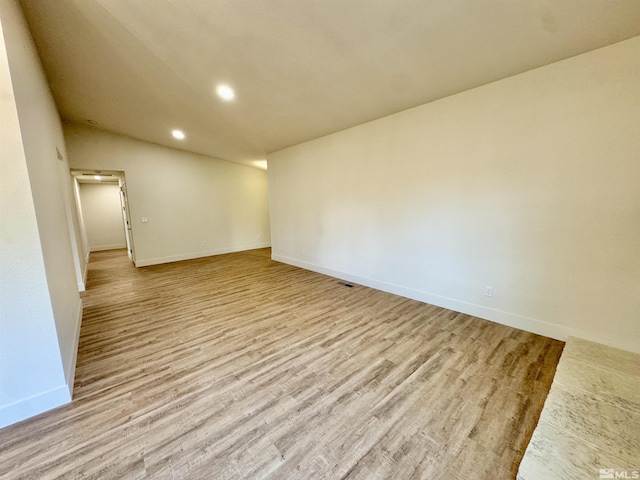 unfurnished room with light hardwood / wood-style flooring