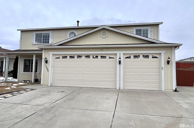 traditional-style home with concrete driveway and an attached garage