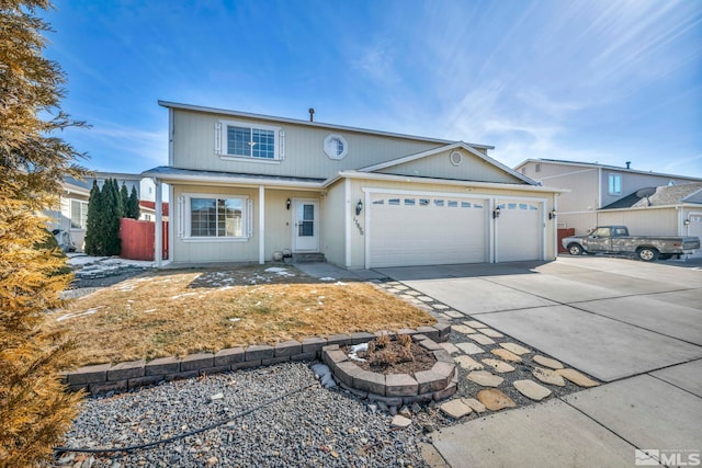 view of front of property featuring a garage, driveway, and fence