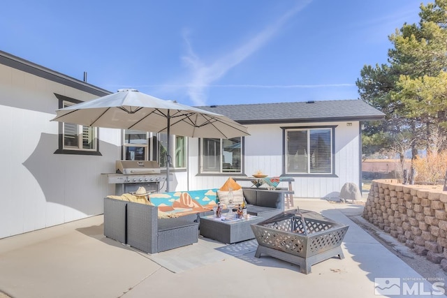 view of patio / terrace with a grill and an outdoor living space with a fire pit