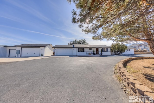 ranch-style house featuring a garage