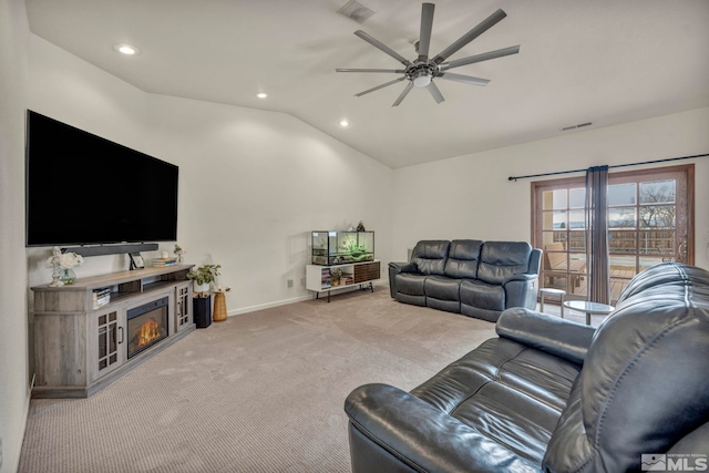 living room with lofted ceiling, light colored carpet, and ceiling fan