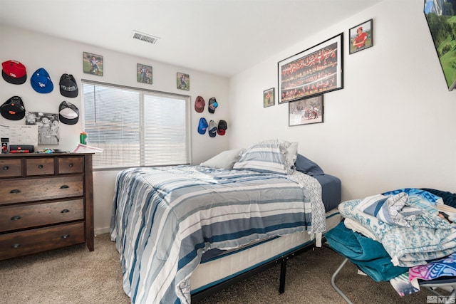 bedroom with light colored carpet