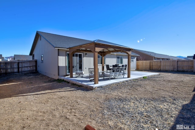 back of property featuring a patio area