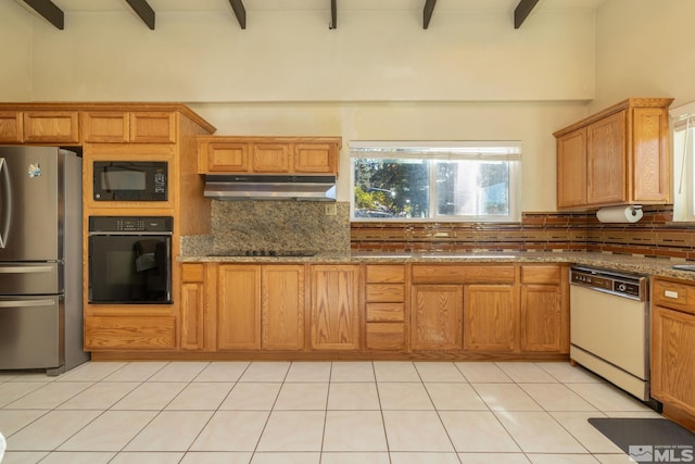 kitchen featuring beam ceiling, backsplash, black appliances, and stone counters