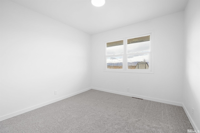 empty room featuring carpet floors