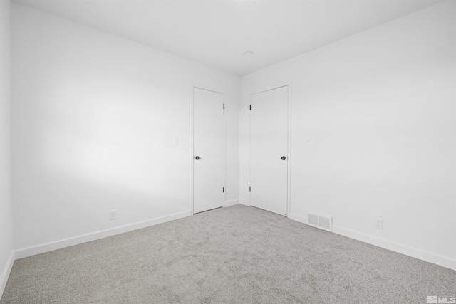 unfurnished room featuring carpet flooring