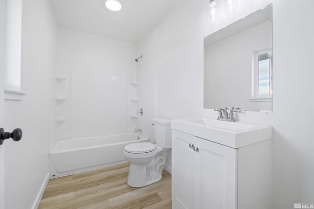 full bathroom featuring toilet, vanity, hardwood / wood-style floors, and shower / bathtub combination