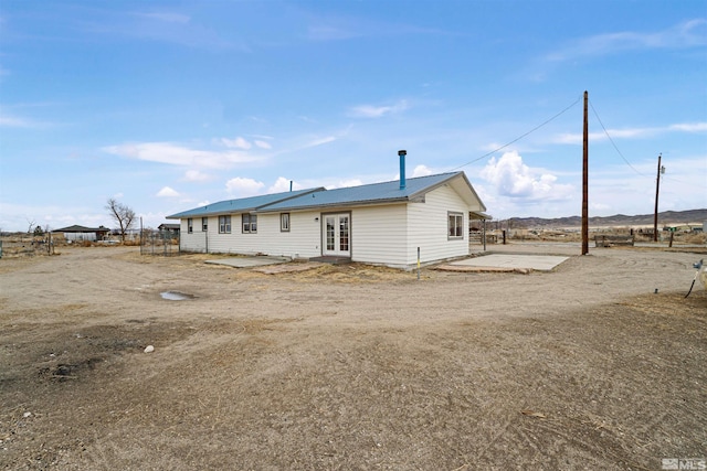 back of property featuring a patio