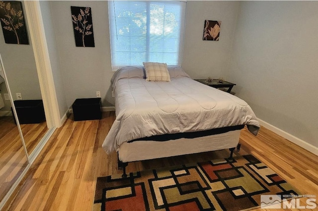 bedroom featuring wood-type flooring