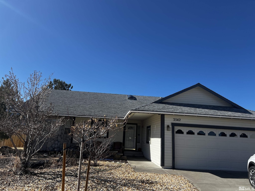 ranch-style house featuring a garage