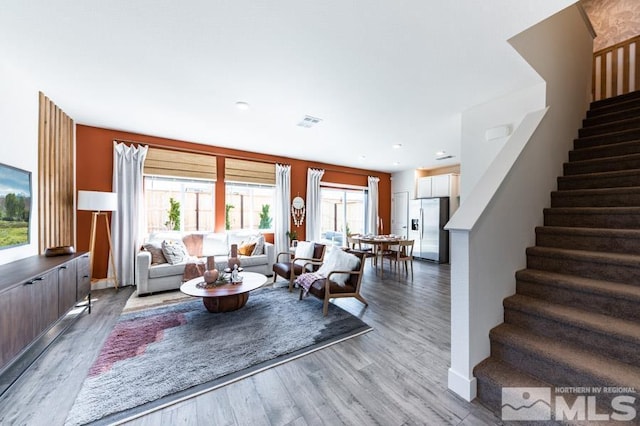 living room with light hardwood / wood-style flooring