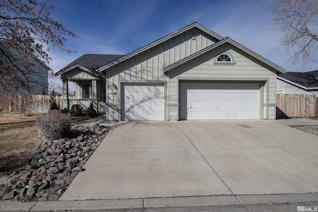 view of front of property featuring covered porch and a garage